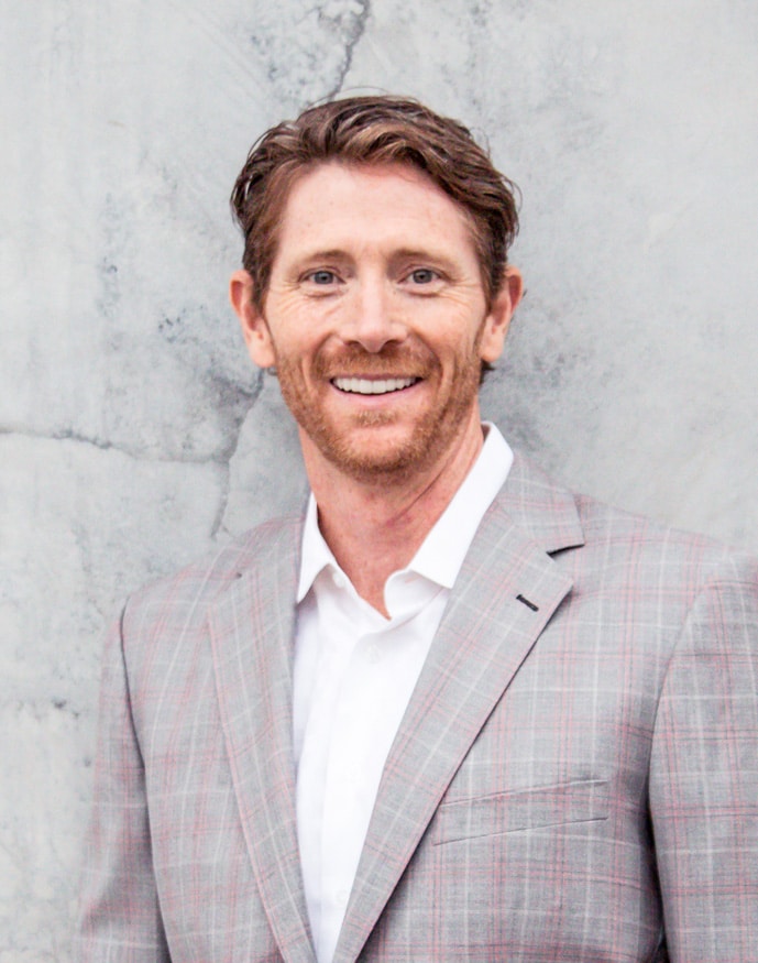 Dr. Robert “Tito” Norris smiling in a professional portrait at Stone Oak Orthodontics, Stone Oak Office and Dominion Office, San Antonio, TX