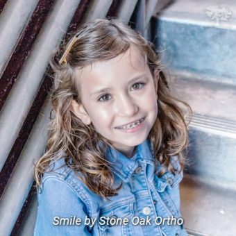 child with braces Stone Oak Orthodontics in San Antonio, TX